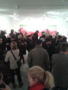 20 Painters crowd Phoenix Brighton in the main hall in front of Emily Ball's giant painting inspired by swimming pools