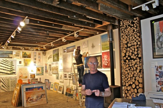 Naked Eye's David Donno (foreground) and Leah Barnett hang the show on Friday 5 September 2014